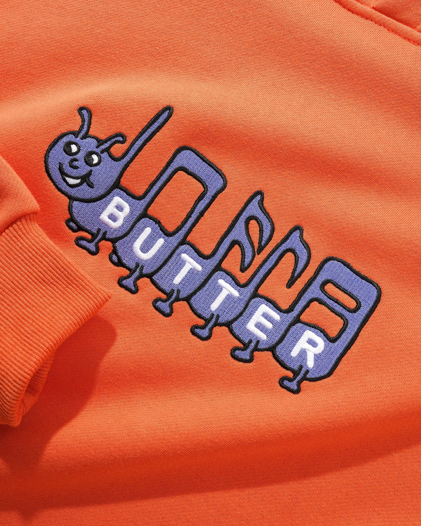  Caterpillar Embroidered Pullover, Washed Orange