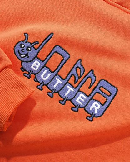  Caterpillar Embroidered Pullover, Washed Orange